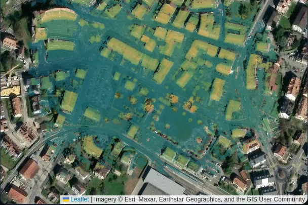 The town's digital surface model, shaded by height, laid over a satellite basemap at its own coordinates.