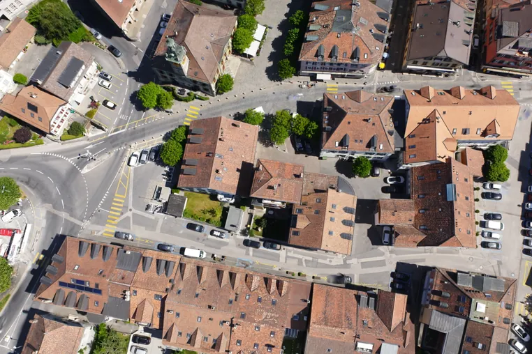 The same splat looking straight down on the old town centre, with tiled roofs, streets and pedestrian crossings.