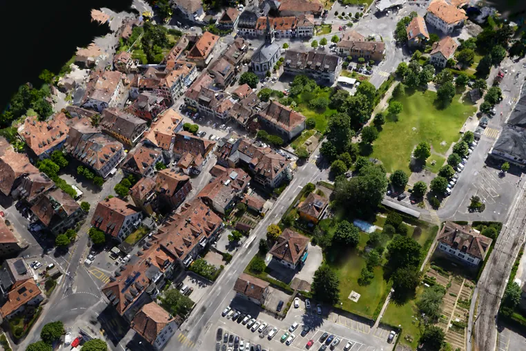 A Gaussian splat of the town seen from above at an angle, the whole scene in one frame.